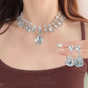 Elegant silver plated waterdrop rhinestone necklace and earring set shown on model