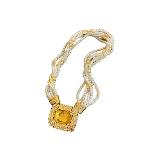 Vintage French court style multi-strand pearl necklace with ornate yellow crystal pendant