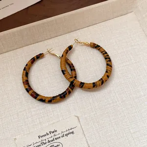Leopard print wrapped hoop earrings with gold-tone needle for a luxury elegant look.