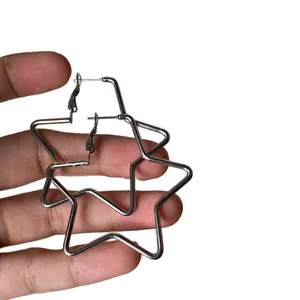 Minimalist silver star hoop earrings for women, stylish and elegant jewelry piece.