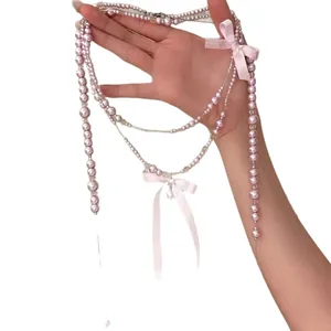 Elegante collana di perle rosa multistrato stile francese con fiocchi dolci da donna