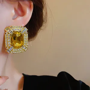 Vintage French palace style oversized gold earrings with yellow crystal detail