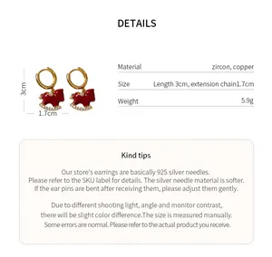 Detail view of gold-plated red rocking horse earrings with size and material specifications