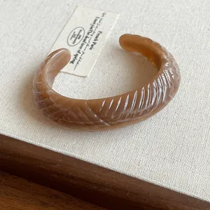 Chunky coffee marbled resin cuff bracelet with irregular ridged texture in vintage style