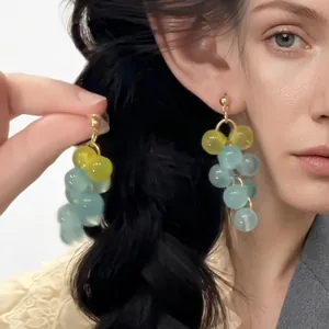 Elegant grape cluster beaded drop earrings in soft pastel blue and yellow colors