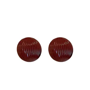 Fashionable deep red striped hemispherical stud earrings with a minimalist textured design