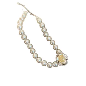 Elegant French style pearl necklace featuring a large rhinestone camellia flower pendant