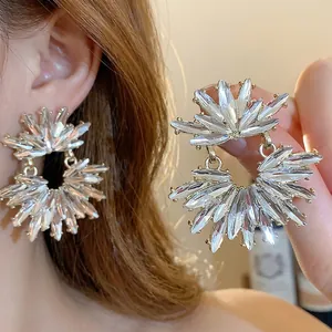 Elegant sparkly crystal sunburst stud earrings with luxury silver needle design for women