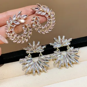Elegant sparkling wheat ear and sunburst cubic zirconia crystal stud earrings for stylish women.