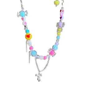 Colorful candy-themed beaded necklace featuring bow and heart charms in Y2K aesthetic