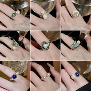 Macro detail view of nine elegant ring styles featuring pearls and colorful gemstones