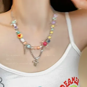 Detailed view of a vibrant dopamine-style colorful beaded necklace with cross pendant