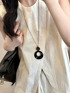 Minimalist black resin circle pendant necklace with wooden bead ethnic style accessory
