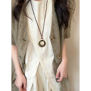 Vintage hollow resin circle pendant necklace with brown cord, ethnic style long chain