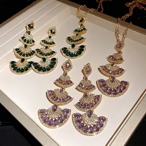 Elegant fan-shaped crystal drop earrings and necklace jewelry set with golden finish