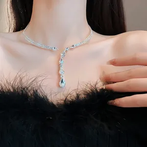 Elegant silver-tone zircon drop necklace worn by a model for a sophisticated look