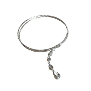Minimalist silver-tone necklace with cascading teardrop zircon crystals on white background