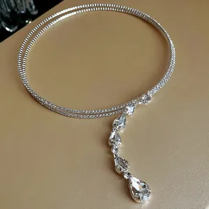 Elegant silver choker necklace featuring a cascading drop of teardrop-shaped zircon crystals