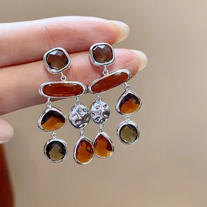 Vintage amber glass geometric drop earrings with silver finish in a layered design