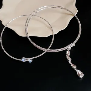 Detailed view of elegant zircon necklaces featuring heart and teardrop crystal pendants