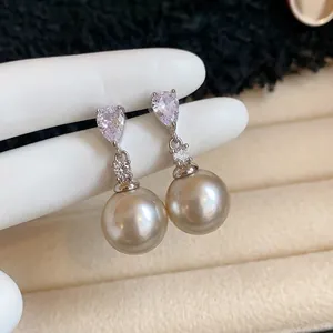 Elegant silver needle drop earrings with pear-cut zircon and large grey pearls