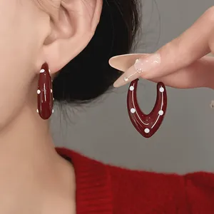 Close-up of retro burgundy enamel polka dot teardrop hoop earrings for women jewelry