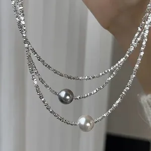 Elegant multi-layer silver bead necklace featuring grey and white pearls for women