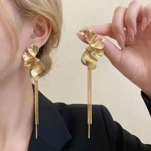 Elegant gold plated flower tassel drop earrings with long chains for a vintage aesthetic look