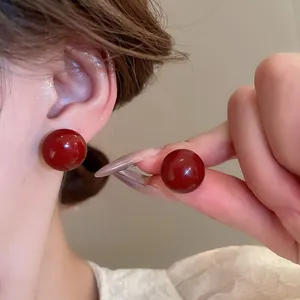 Elegant minimalist red spherical stud earrings with glossy oil-drop finish for women