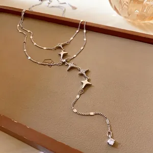 Elegant stainless steel double-layer tassel necklace with sparkling zircon star charms.