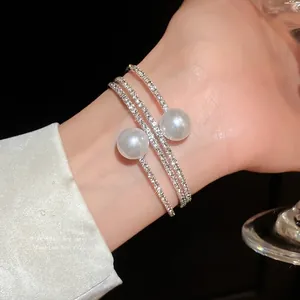 Luxurious three-layer silver open bangle with sparkling rhinestones and elegant white pearls