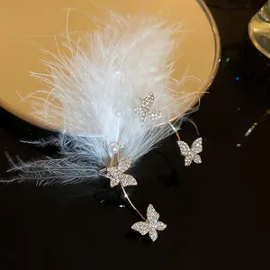 Elegant silver rhinestone butterfly pearl ear cuff with soft white feather decoration
