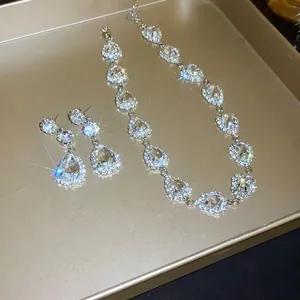 Detailed view of elegant silver-toned water drop jewelry set with sparkling rhinestones
