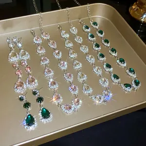 Detailed view of luxury rhinestone water drop necklace and earring set in multi-colored stones