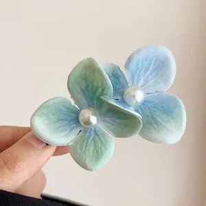 Elegant blue and green floral hair claw clip with pearl center for women