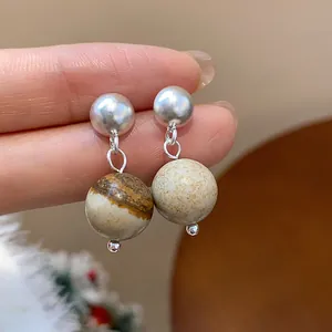 Retro handmade beaded drop earrings with marble pattern stone and silver studs.