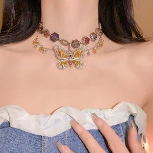 Detailed view of vintage butterfly necklace with diamond-encrusted wings and floral accents