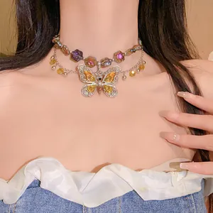 Close-up of vintage butterfly layered necklace with colorful crystal flower charms