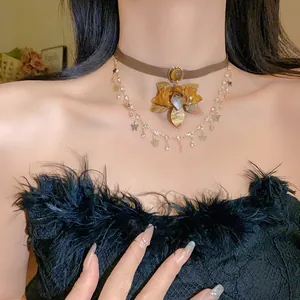 Close-up of vintage multi-layer necklace with flower pendant and butterfly charms