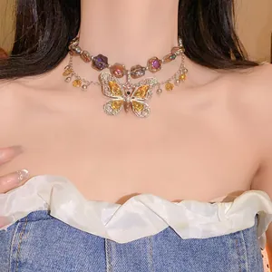 Close-up of vintage multi-layer necklace with a large crystal butterfly pendant.
