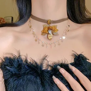Close-up of vintage multi-layer choker necklace with flower pendant and butterfly charms.
