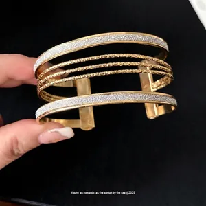 Elegant multi-layer gold open cuff bracelet with glitter silver accents for women