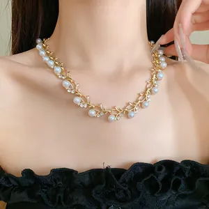 Detailed view of elegant French style necklace with faux pearls and rhinestones