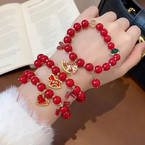 Elegant red beaded bracelet set with gold horse charms for luxury women's fashion