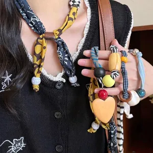 Retro fabric and wood heart necklace with leopard print beads for women