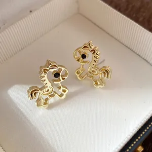Elegant golden hollow horse stud earrings with sparkling black rhinestone eyes for women