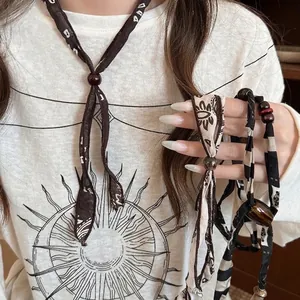 Vintage Maillard style bohemian fabric and wooden necklace with leopard pattern
