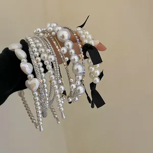 Serre-têtes élégants en perles et strass style français avec nœuds noirs pour femme.