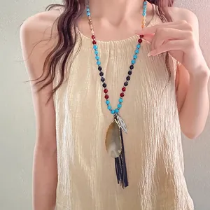 Vintage ethnic style beaded necklace with teardrop agate pendant and leaf charm tassel