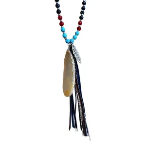Ethnic style beaded necklace featuring a teardrop agate pendant and layered leather tassels